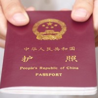 Chinese-passport-in-hand